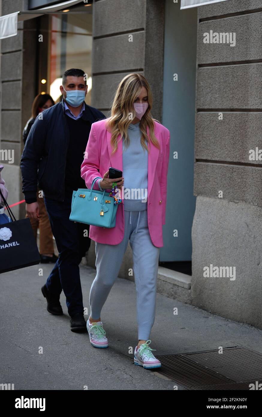 Chiara Ferragni is wearing a Chanel bag, and a Chanel coat, after