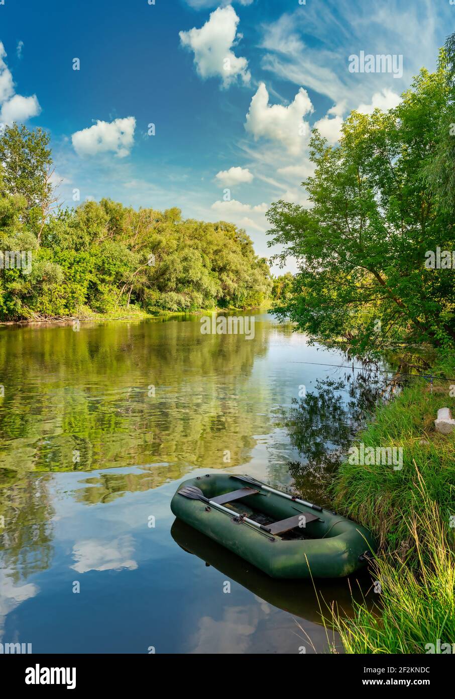 Inflatable boat on river at the sunrise Stock Photo