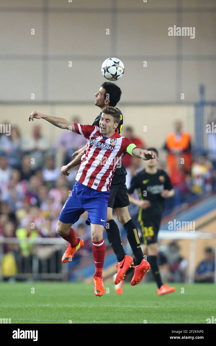 Gabi of Atletico de Madrid duels for the ball with Sergio Busquets of FC Barcelona during the UEFA Champions League 2013/2014 football match 1/4 Final , 2nd Leg between Atletico Madrid and FC Barcelona on April 9, 2014 at Vicente Calderon stadium in Madrid, France. Photo Manuel Blondeau / AOP PRESS/ DPPI - Stock Photo