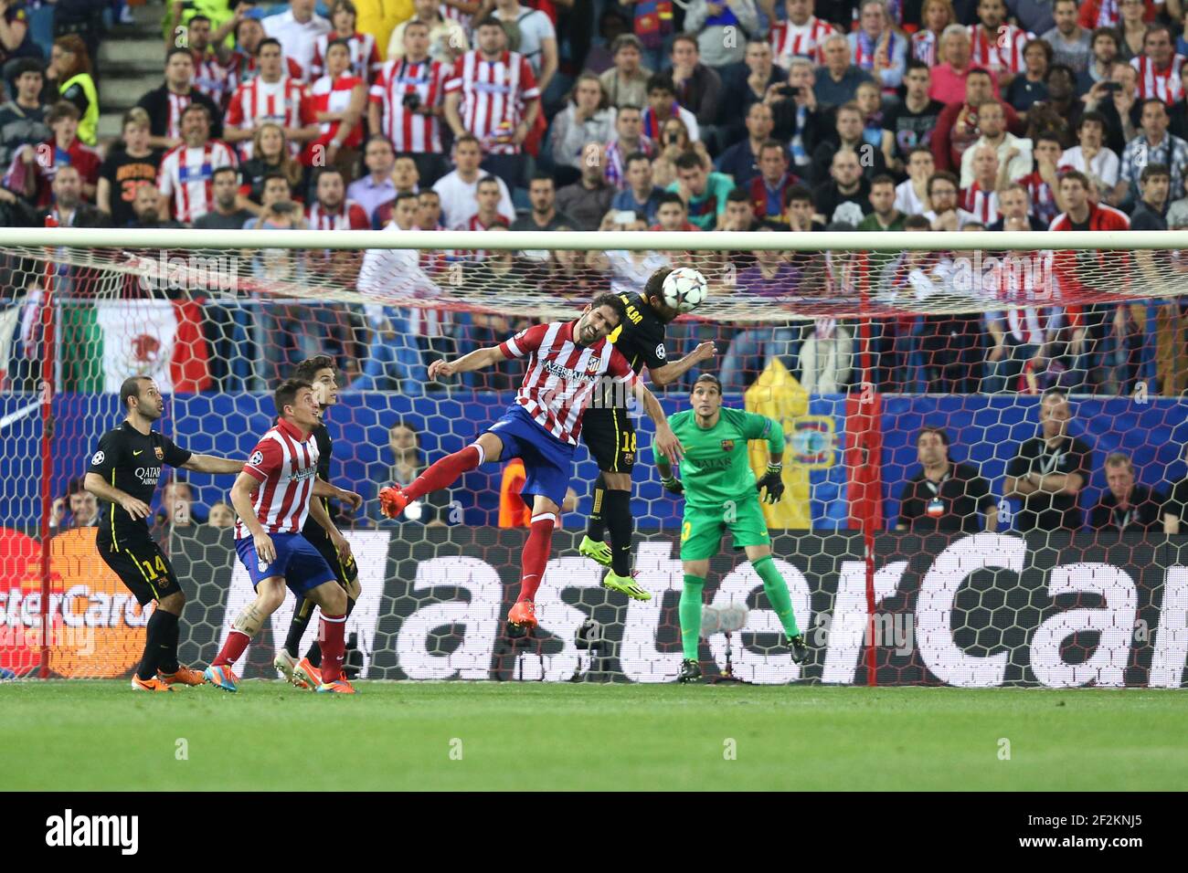 Raul Garcia of Atletico de Madrid heads the ball during the UEFA Champions  League 2013/2014 football match 1/4 Final , 2nd Leg between Atletico Madrid  and FC Barcelona on April 9, 2014