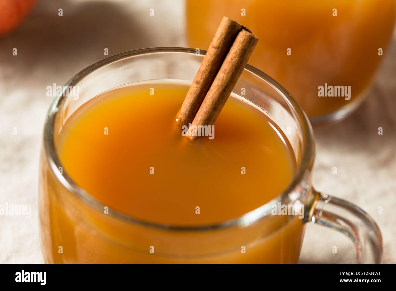 Organic Warm Refreshing Apple Cider Juice with a Cinnamon Stick Stock Photo