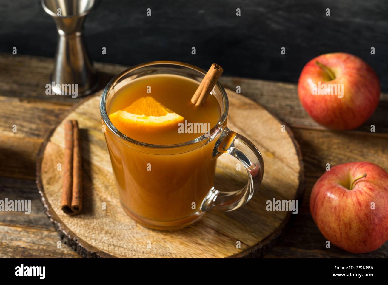 Boozy Warm Apple Cider Cocktail with Whiskey and Orange Stock Photo