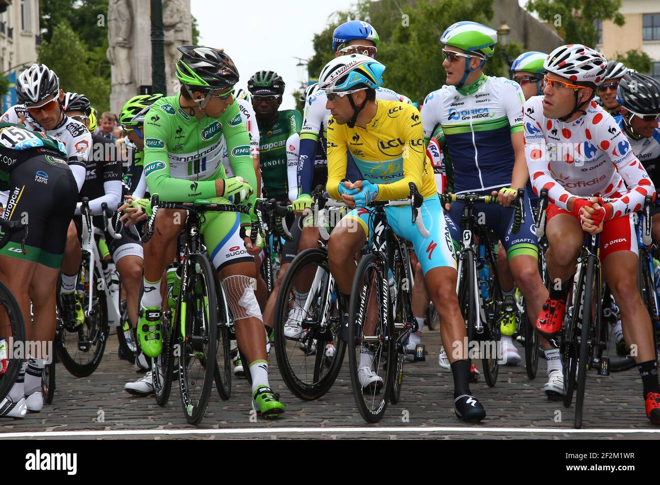 Peter Sagan of Slovakia riding for Cannondale (green jersey), Vincenzo  Nibali of Italy riding for Astana Pro Team (yellow jersey) and Cyril  Lemoine of France riding for Cofidis (polka dot jersey) are