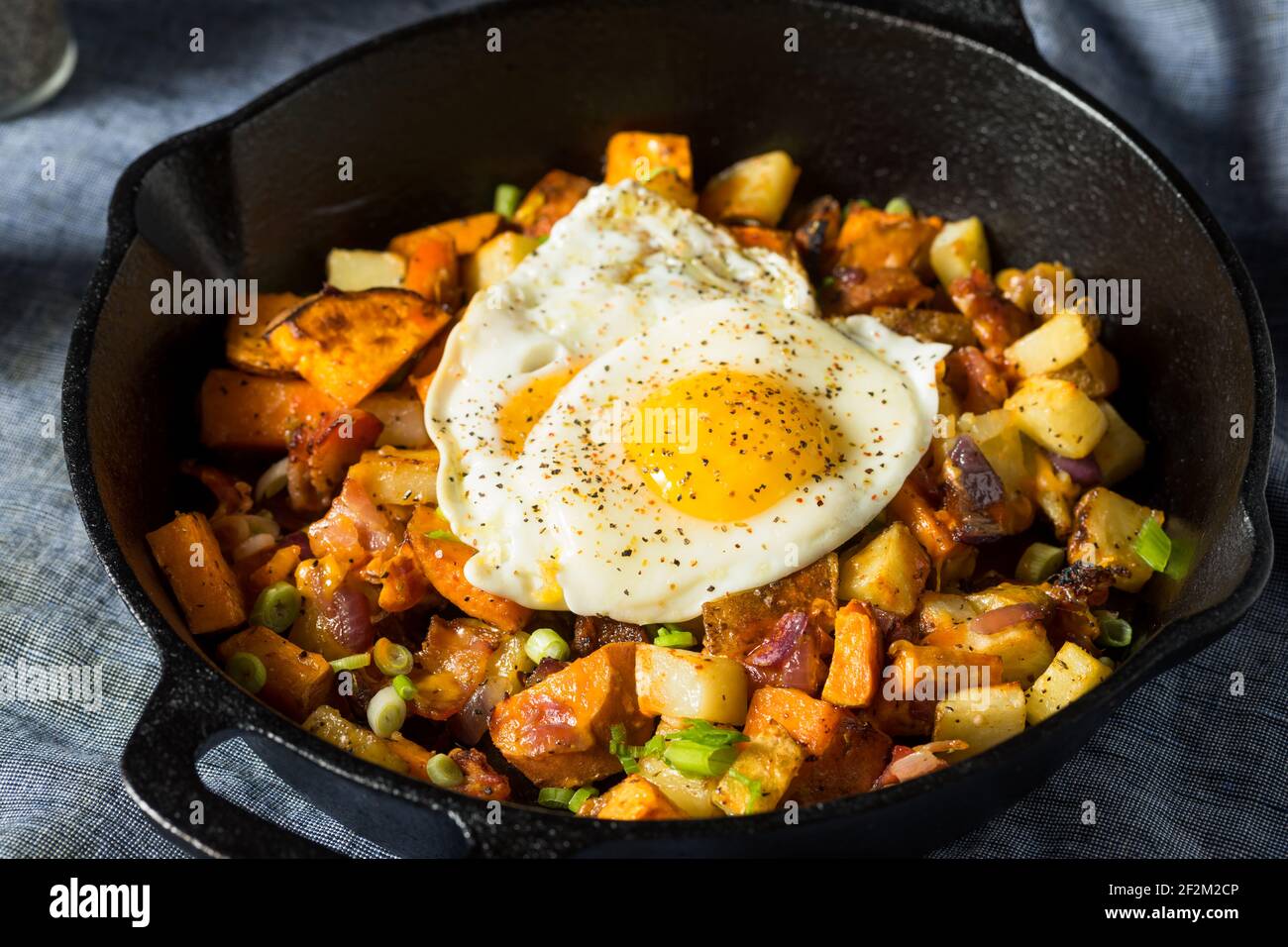 Homemade Healthy Sweet Potato Hash with Fried Eggs Stock Photo Alamy