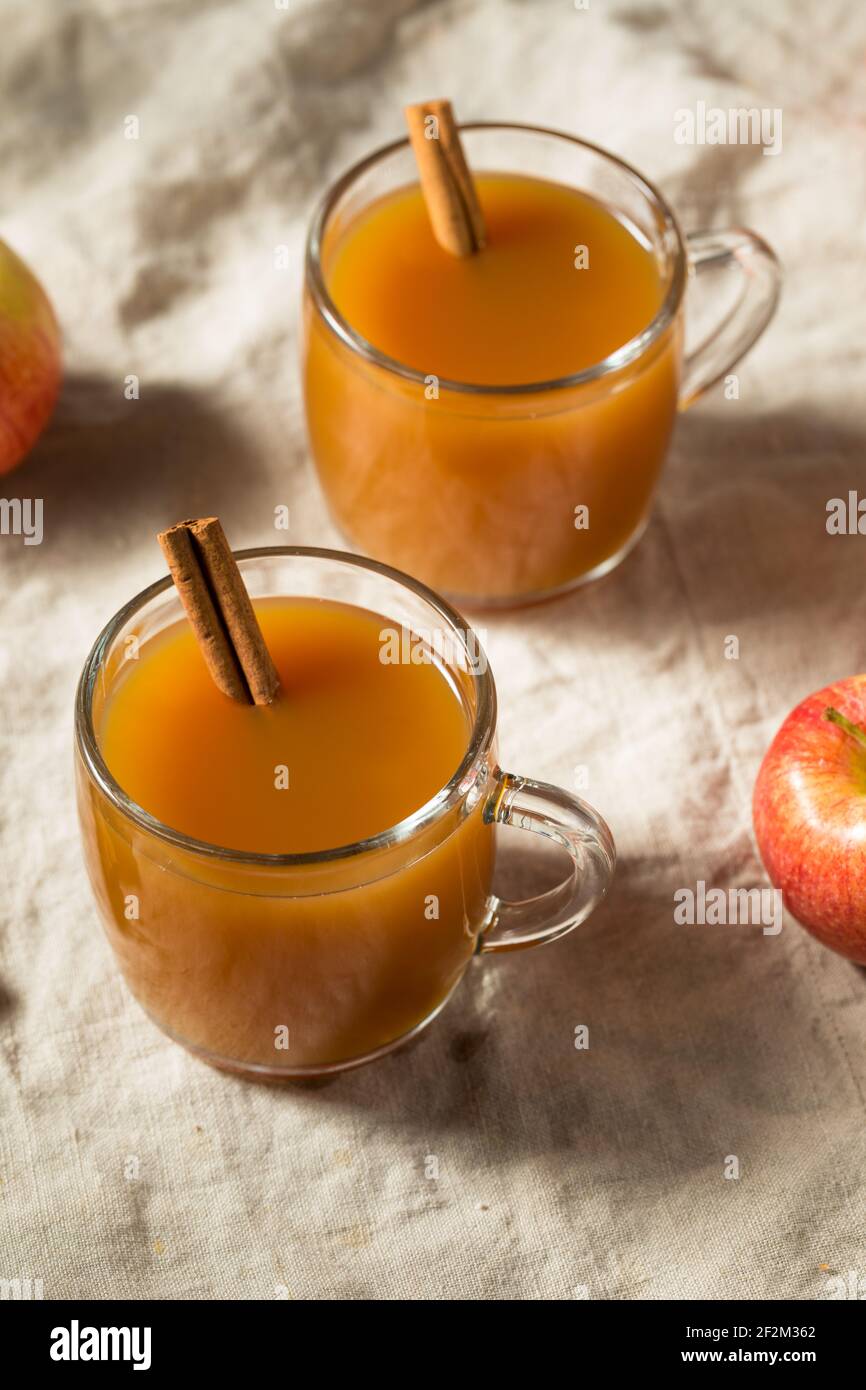 Organic Warm Refreshing Apple Cider Juice with a Cinnamon Stick Stock Photo