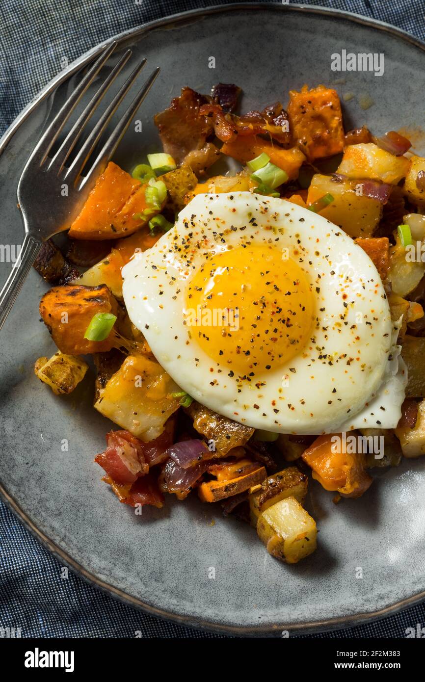 Homemade Healthy Sweet Potato Hash with Fried Eggs Stock Photo Alamy