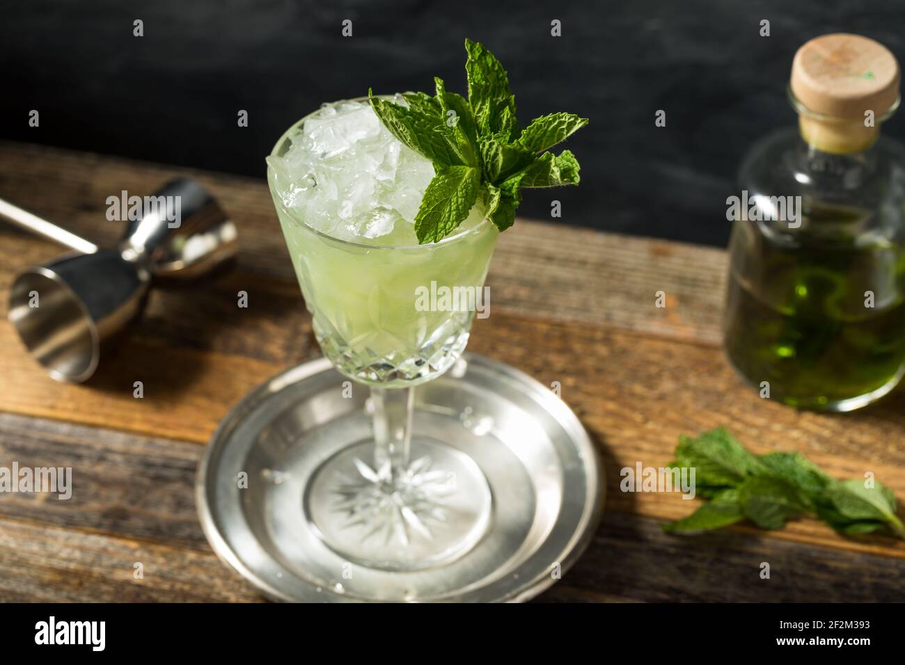 Boozy Refreshing Absinthe Frappe Cocktail with Ice and Mint Stock Photo