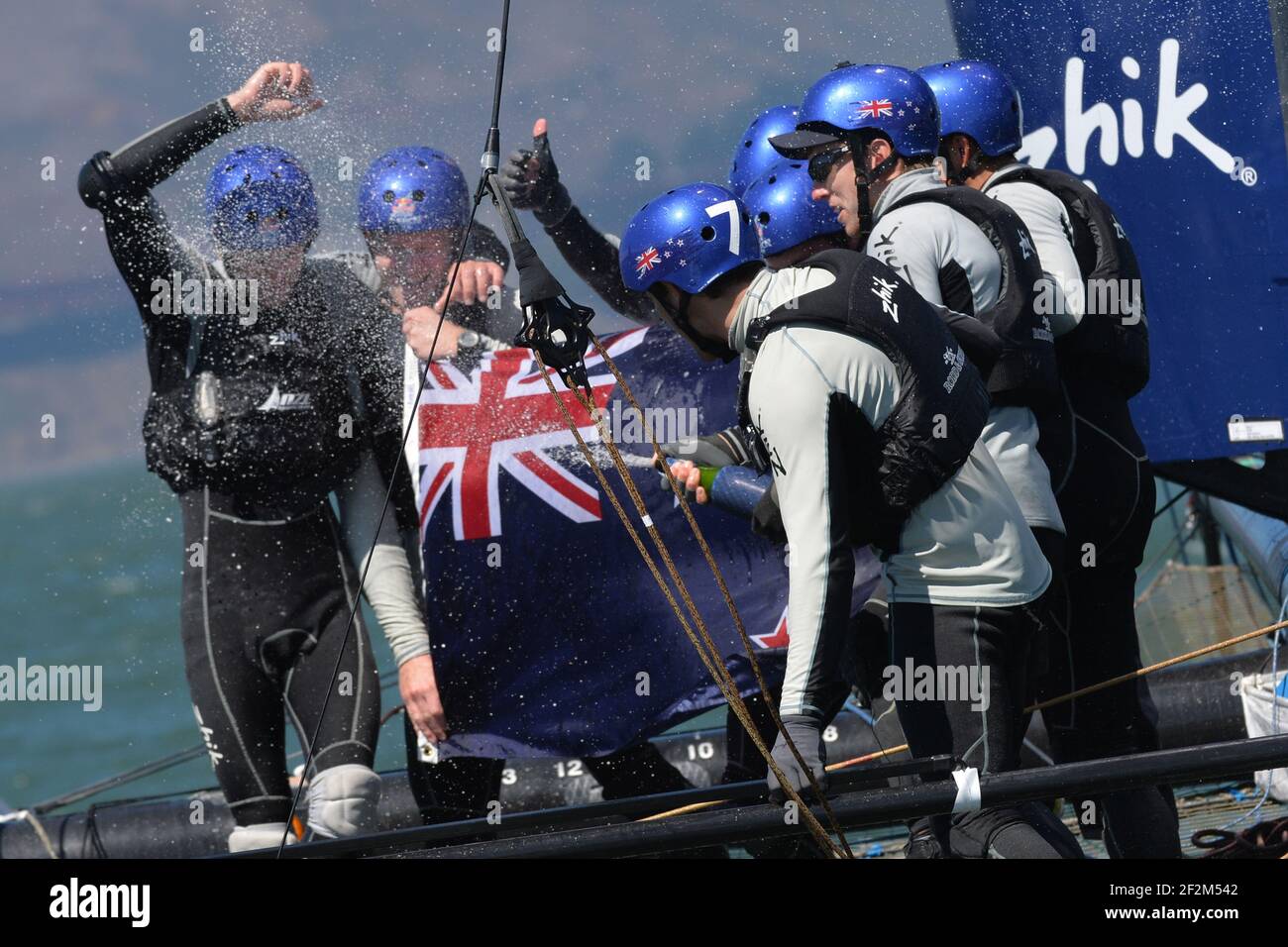 Victory celebration with a New Zealand flag for Peter Burling, skipper of NZL Sailing Team with ETNZ (NZL), and his crew after winning the Red Bull Youth America's Cup held on AC45 off San Francisco (west USA) from september 1st till 4th, 2013 - Photo : Christophe Favreau / DPPI Stock Photo