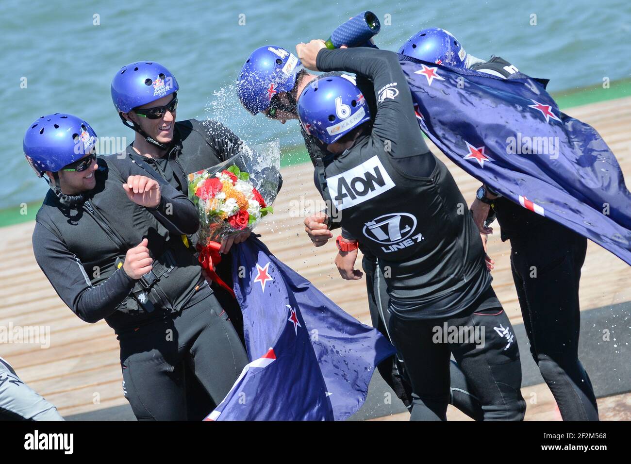 Victory celebration with a New Zealand flag for Peter Burling, skipper of NZL Sailing Team with ETNZ (NZL), and his crew after winning the Red Bull Youth America's Cup held on AC45 off San Francisco (west USA) from september 1st till 4th, 2013 - Photo : Christophe Favreau / DPPI Stock Photo