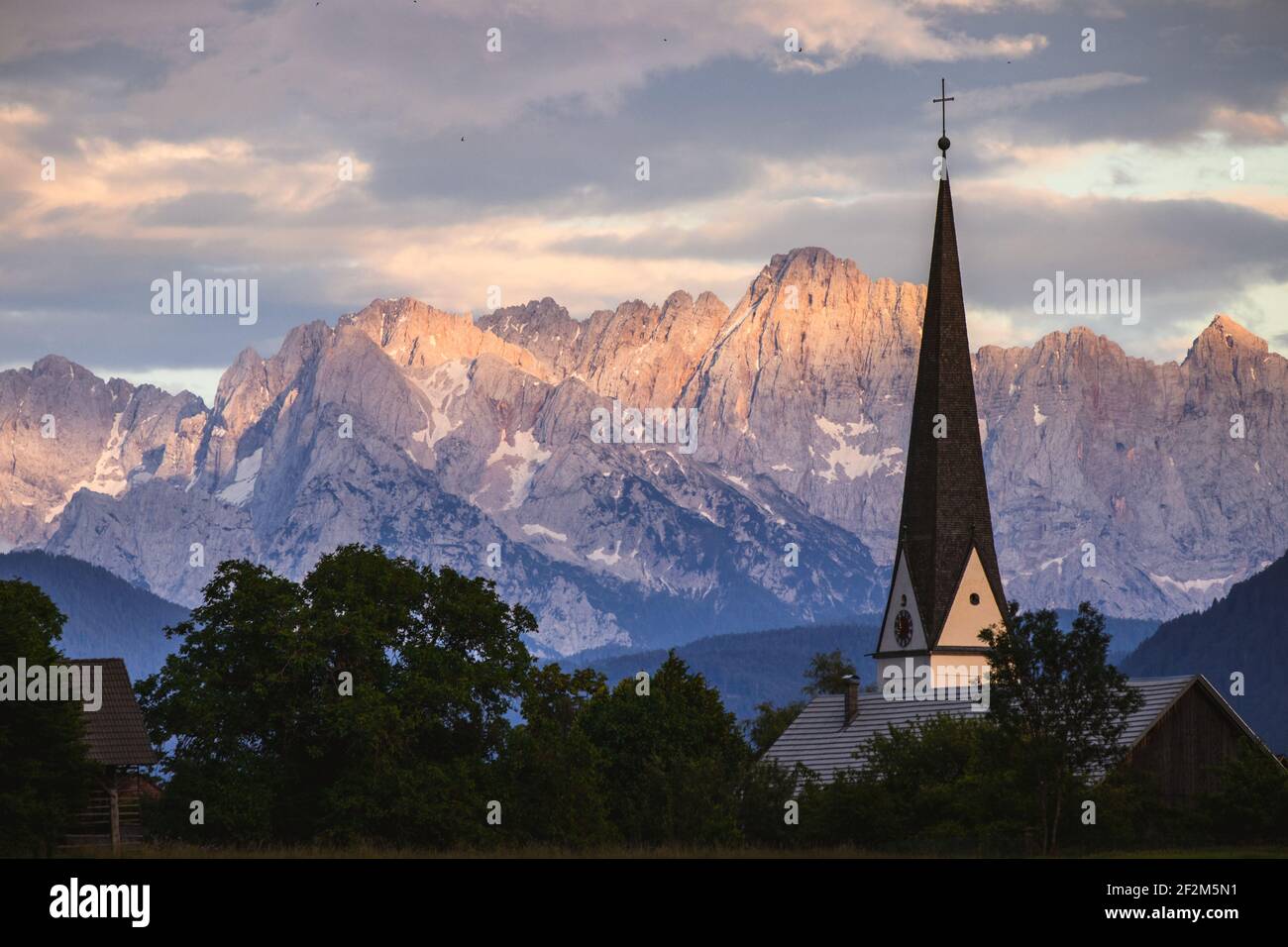 Austria, Carinthia, St. Stefan im Gailtal, parish church St. Stefan an der Gail, church tower in front of the Julian Alps Stock Photo