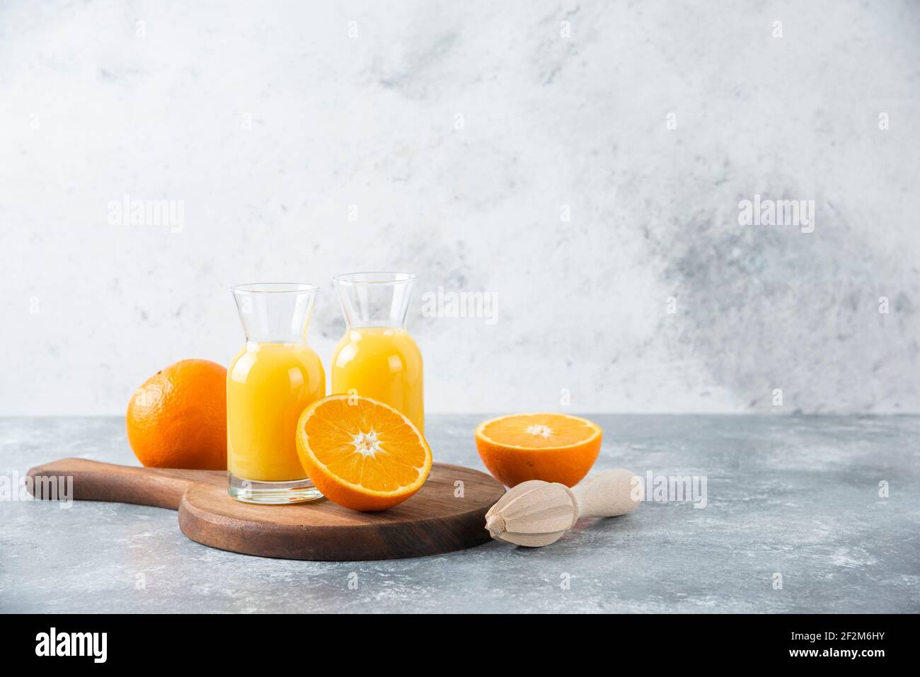 Glass pitchers of juice with slice of orange fruit Stock Photo