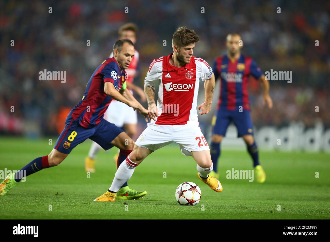 Lasse Schone of AFC Ajax duels for the ball with Andres Iniesta of FC Barcelona during the UEFA Champions League, Group F, football match between FC Barcelona and Ajax Amsterdam on October 21, 2014 at Camp Nou Stadium in Barcelona, Spain. Photo MANUEL BLONDEAU / AOP PRESS / DPPI Stock Photo