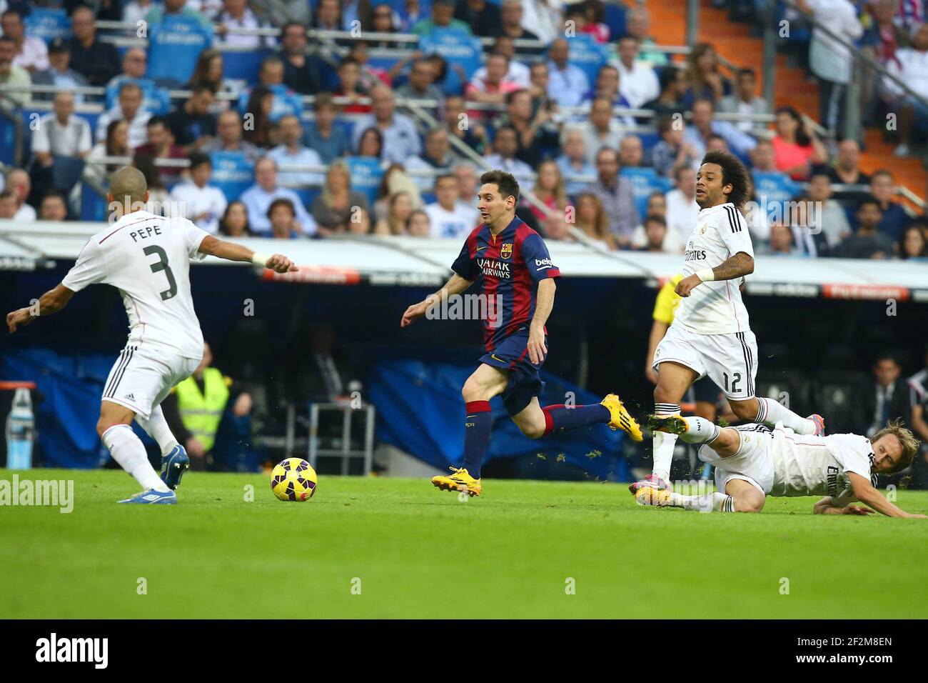 Lionel Messi of FC Barcelona evades Luka Modric of Real Madrid during the Spanish Championship Liga football match between Real Madrid CF and FC Barcelona, at Santiago Bernabeu Stadium in Madrid, Spain, on October 25, 2014. Photo Manuel Blondeau / AOP.press / DPPI Stock Photo