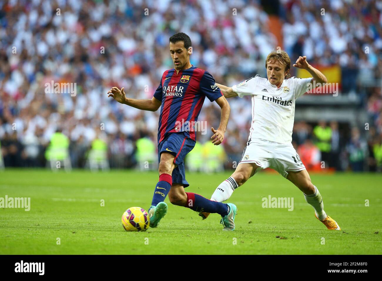 Sergio Busquets of FC Barcelona evades Luka Modric of Real Madrid during the Spanish Championship Liga football match between Real Madrid CF and FC Barcelona, at Santiago Bernabeu Stadium in Madrid, Spain, on October 25, 2014. Photo Manuel Blondeau / AOP.press / DPPI Stock Photo
