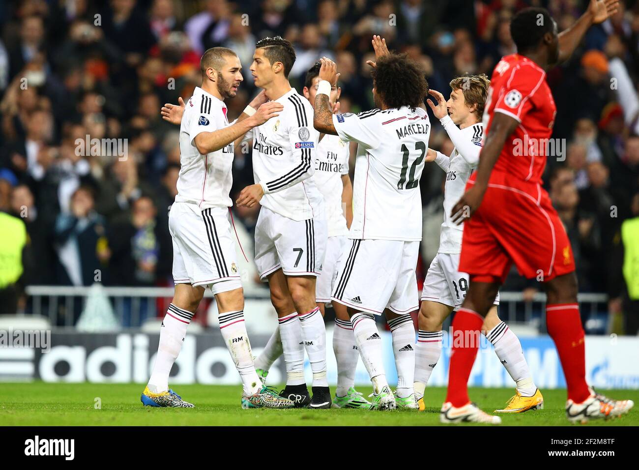 Karim Benzema of Real Madrid CF celebrates with Cristiano Ronaldo after ...