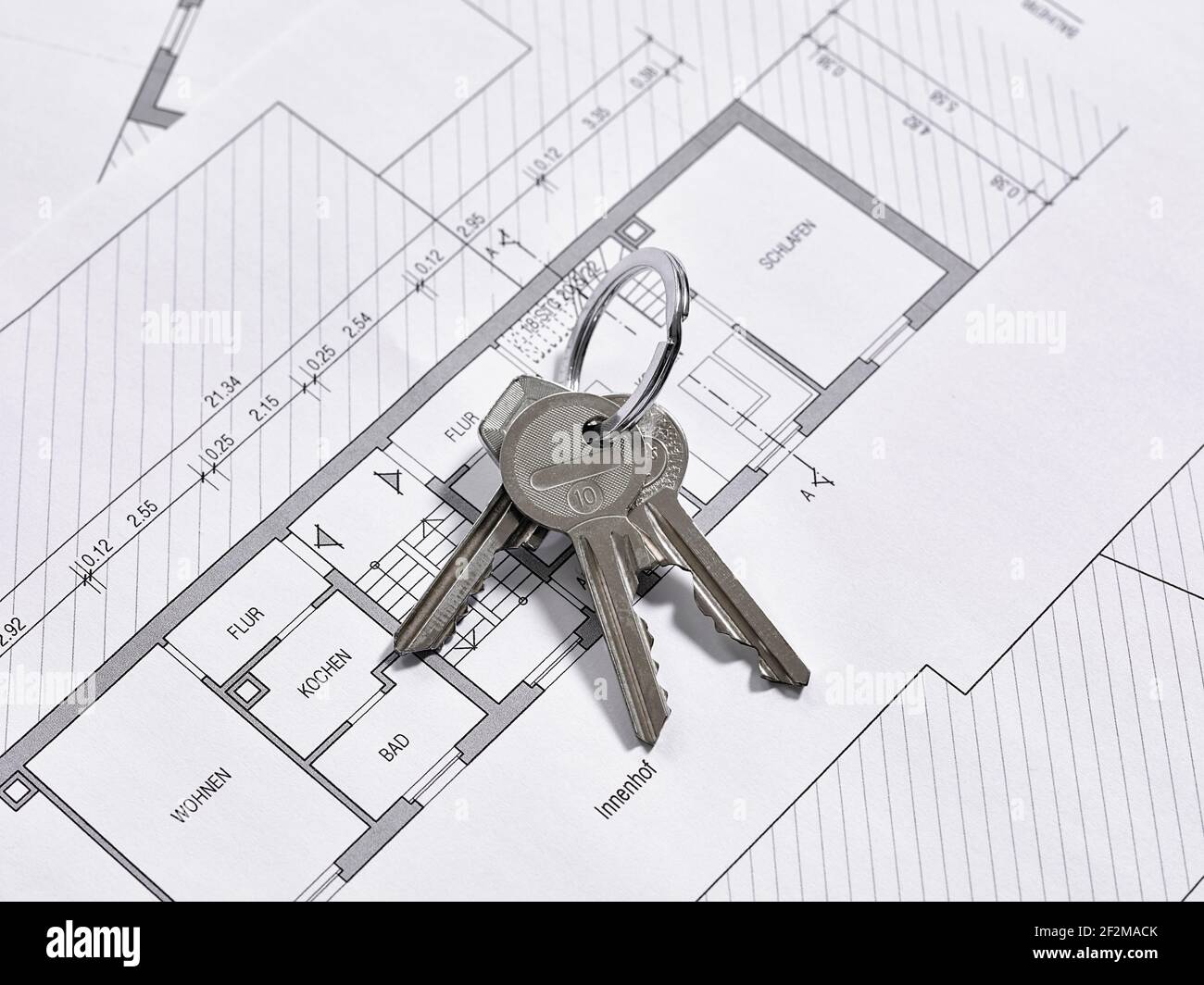 Bunch of keys lies on a floor plan drawing of an apartment Stock Photo
