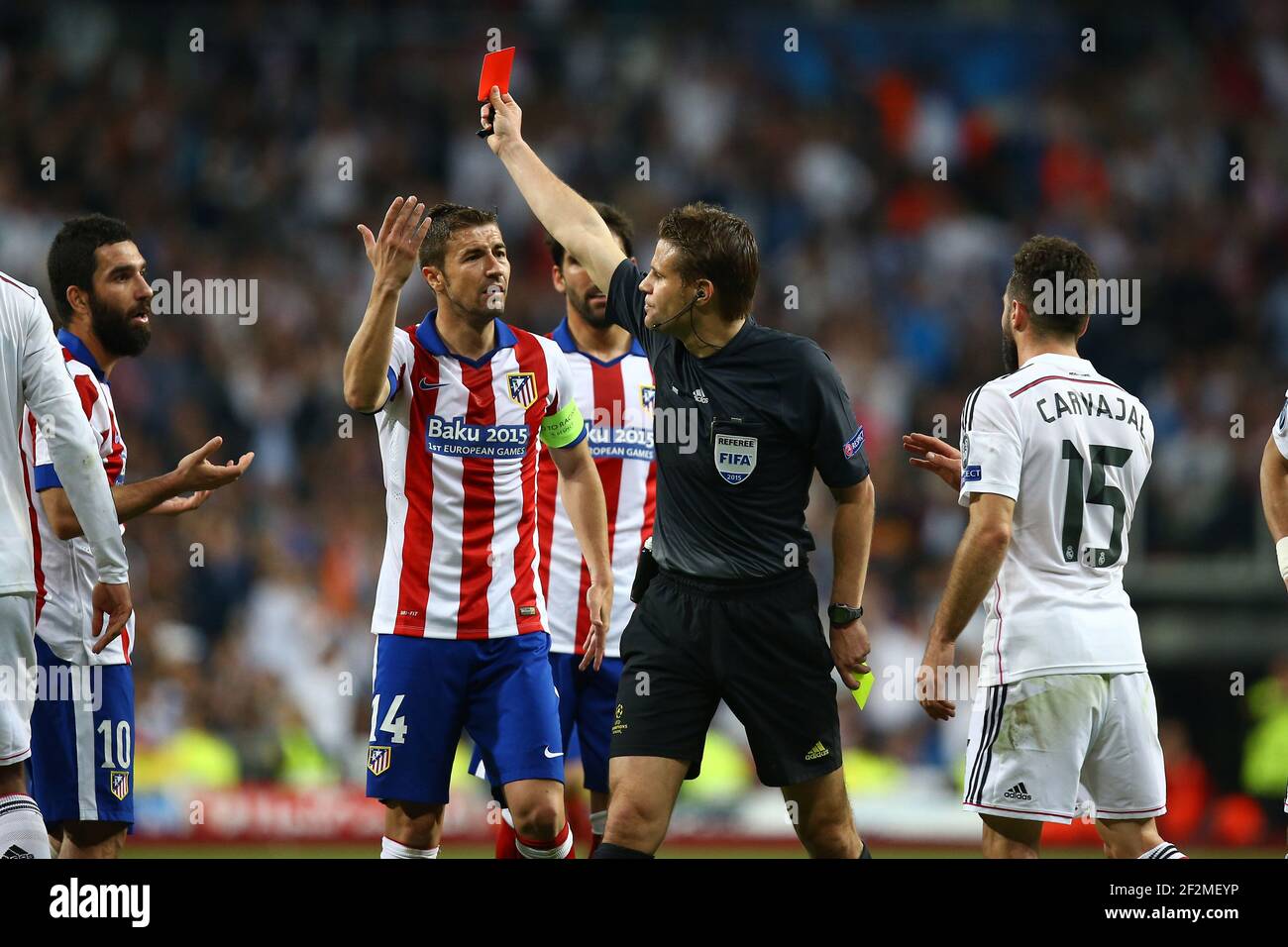sadel Lao prop Referee Felix Brych shows a red card to Arda Turan of Atletico de Madrid  during the UEFA Champions League football match quarter final, 2 leg,  between Real Madrid and Atletico Madrid on