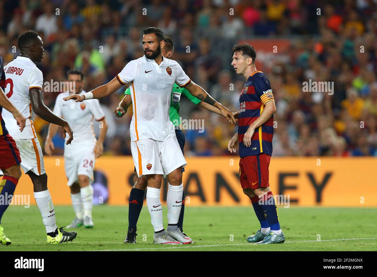 Lionel Messi Of Fc Barcelona Argues With Mapou Yanga Mbiwa Of As Roma