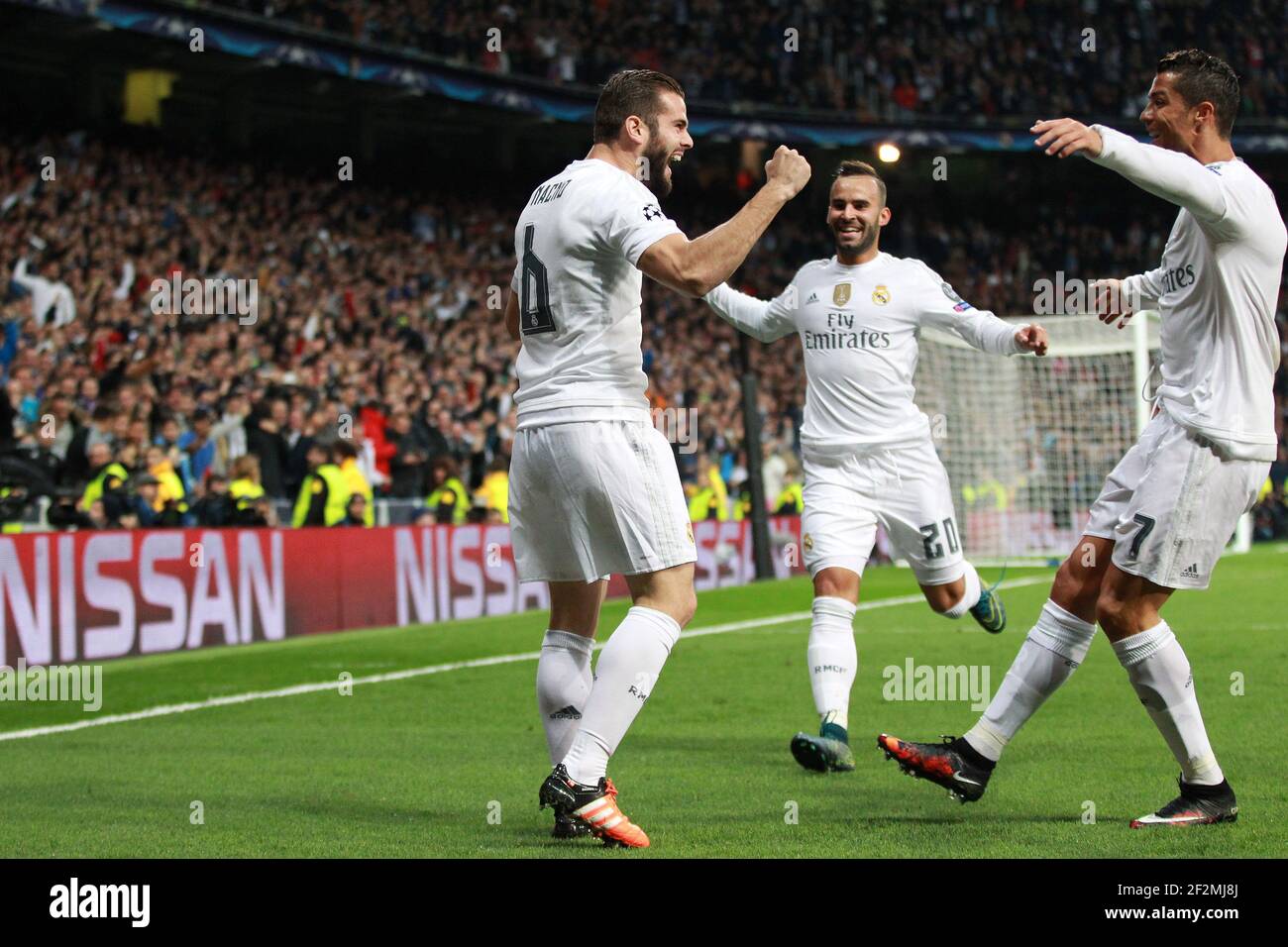 Nacho Fernandez Of Real Madrid Celebrates With Cristiano Ronaldo And Jesse Rodriguez After Scoring His Side S Opening Goal During The Uefa Champions League Group A Football Match Between Real Madrid And Paris