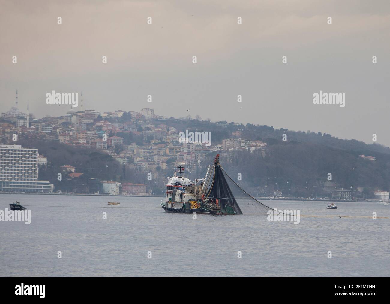 (210312) -- ISTANBUL, March 12, 2021 (Xinhua) -- A fishing boat is seen on the Black Sea in Istanbul, Turkey, on March 6, 2021. The Black Sea is packed with local bottom fishes, including haddock, mullet, and turbot. There are also migrating fishes from the Atlantic Sea, such as bonito, bluefish, anchovy, and horse-mackerel. However, climate change, overfishing, and other natural causes have had tremendous adverse impacts on the stocks of fisheries and aquaculture. Restrictions related to the COVID-19 pandemic, as well as the rising costs of labor, fuel, and equipment also preoccupy the fisher Stock Photo