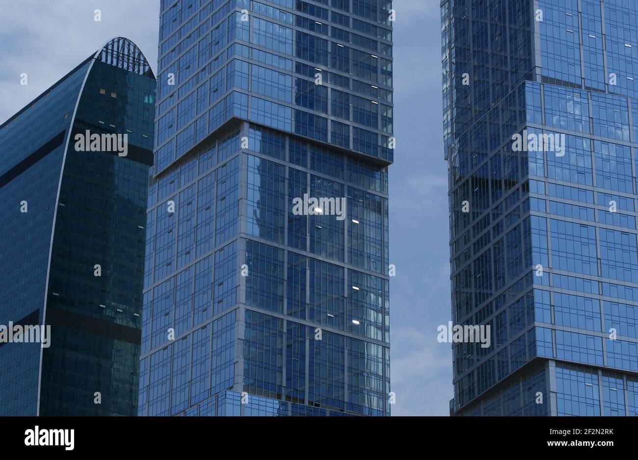 Reflection of a cloudy sky in glass wall of an office building Stock ...