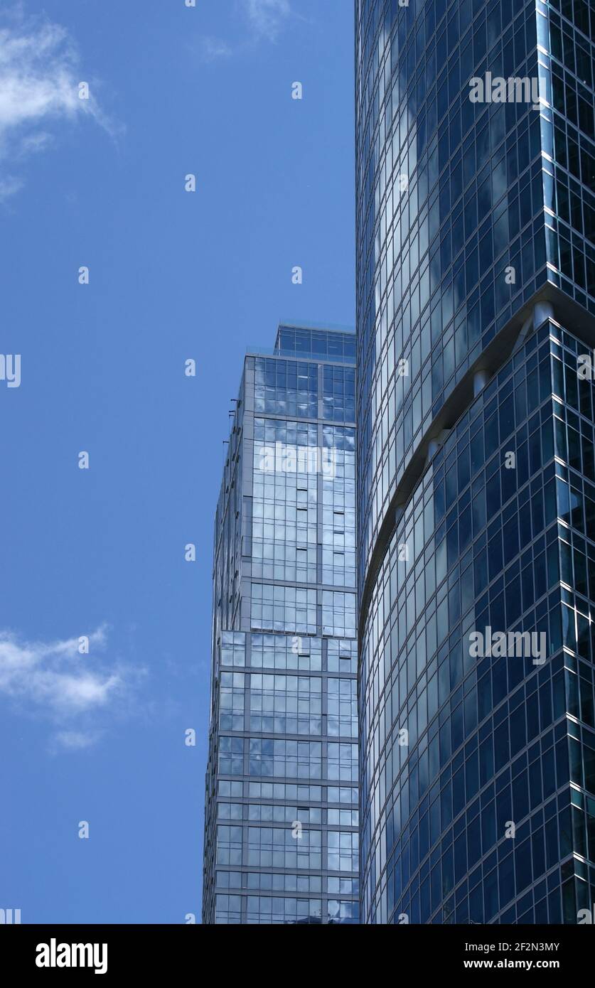 Reflection of a cloudy sky in glass wall of an office building Stock ...