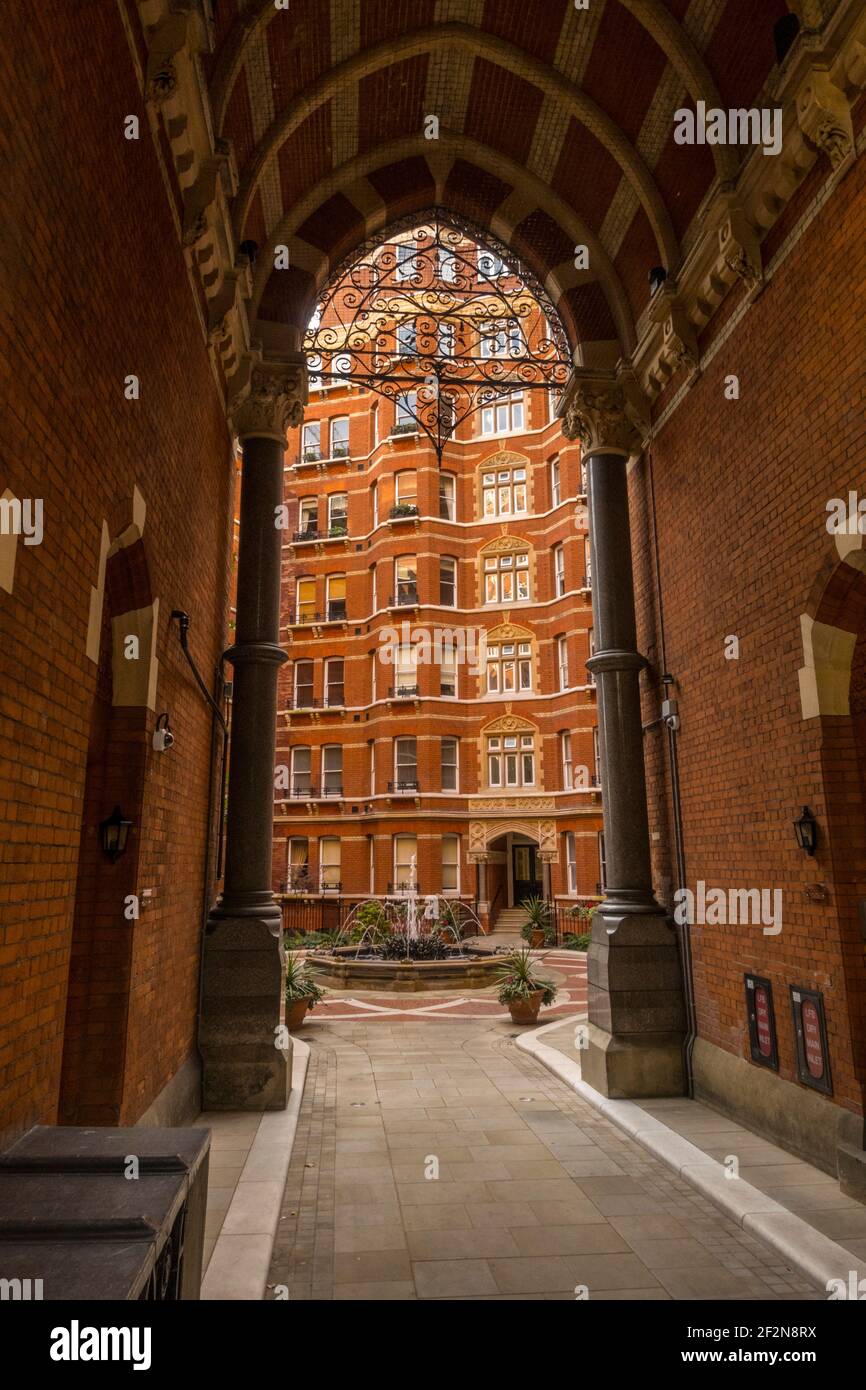 The entrance and courtyard of Artillery Mansions Victoria st, Westminster London. Stock Photo