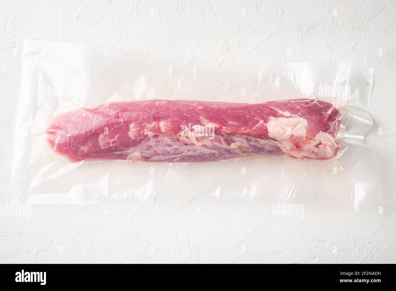 Vacuum packaging of meat products pork fillet tenderloin set, on