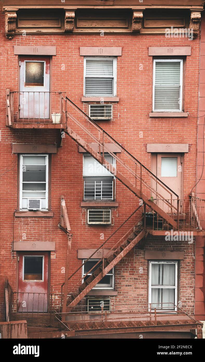 Old brick tenement house with fire escape, New York City, USA. Stock Photo