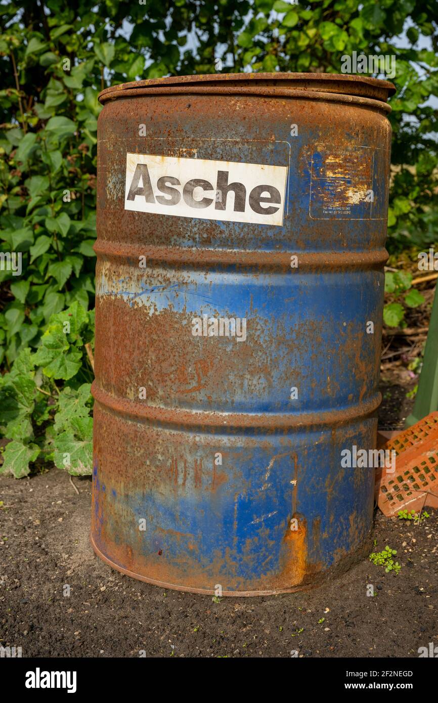 Ash bin in a garden Stock Photo Alamy