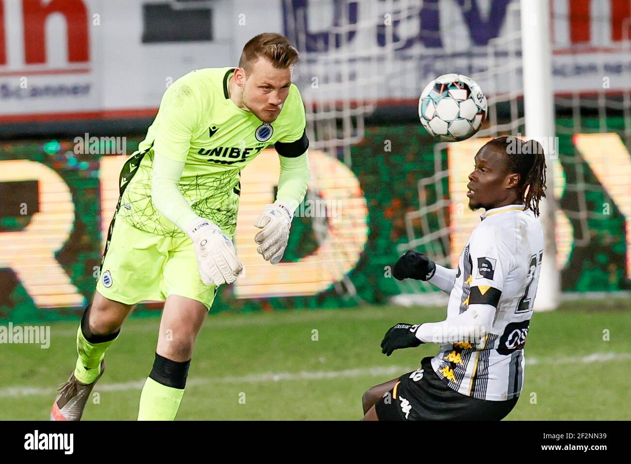 Club's goalkeeper Simon Mignolet and Charleroi's Mamadou Fall fight for the ball during a postponed soccer match between Sporting Charleroi and Club B Stock Photo