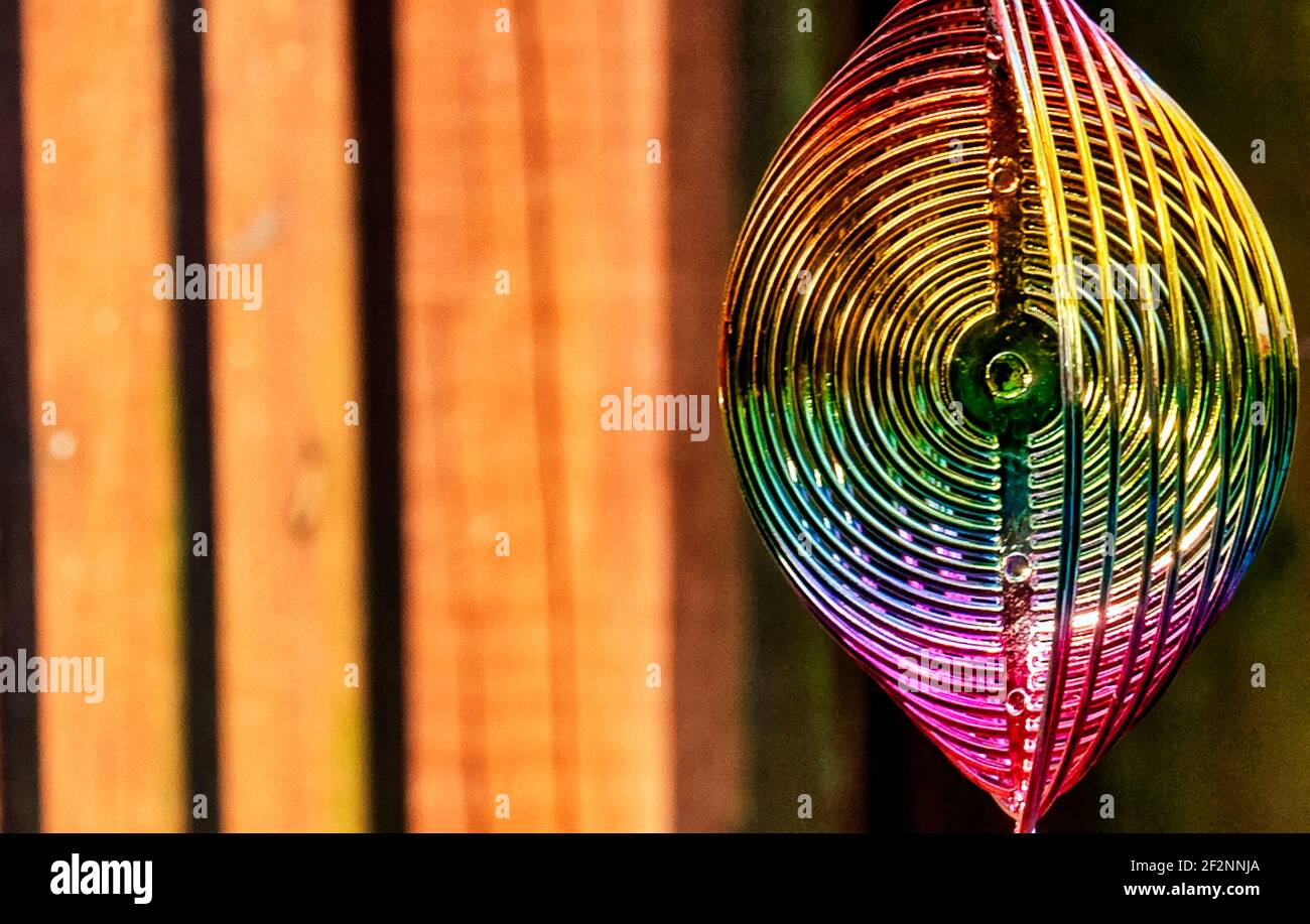 metal garden ornament twists around in the sun Stock Photo Alamy