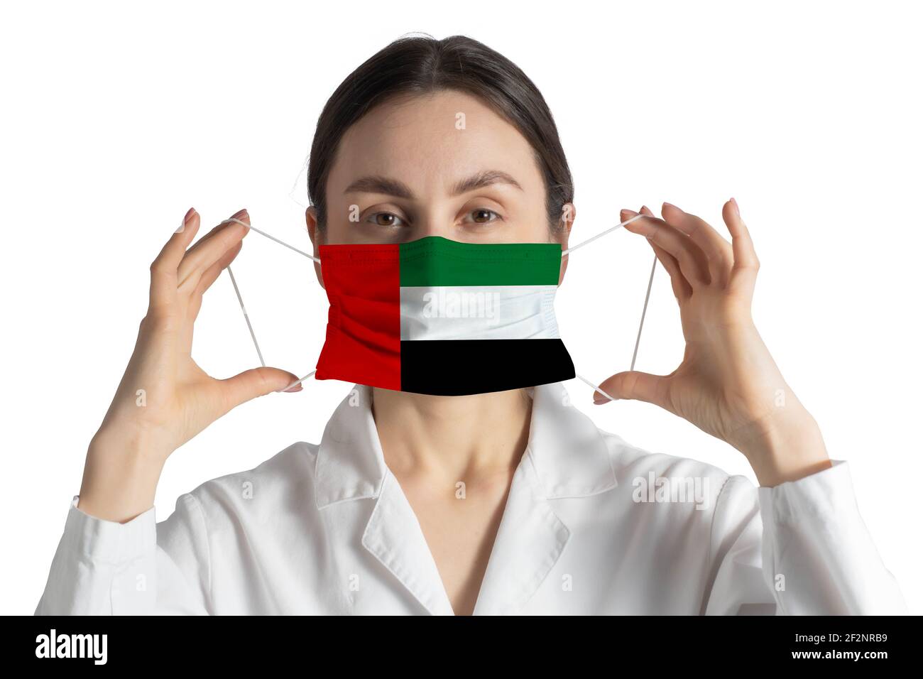 Respirator with flag of United Arab Emirates Doctor puts on medical