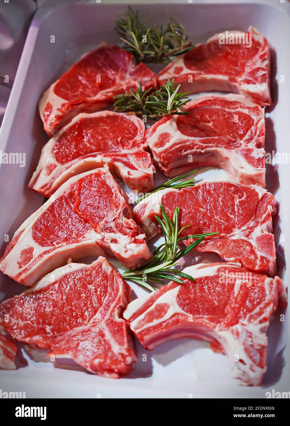 Raw lamb chops on a tray in an Italian butcher shop Stock Photo