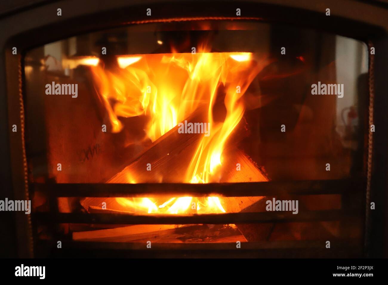 Fire burning bright in a furnace in winter Stock Photo Alamy
