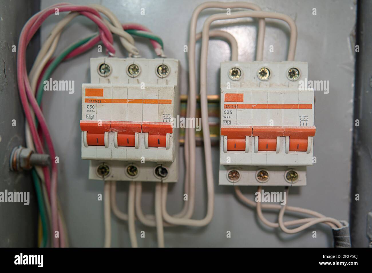 Voltage switchboard with circuit breakers. Electrical background. Stock Photo