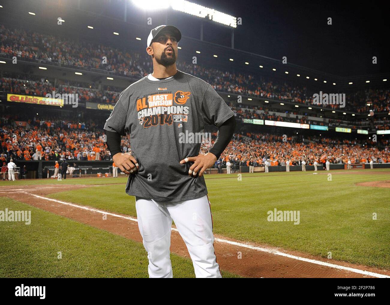 Baltimore, USA. 16th Sep, 2014. The Baltimore Orioles' Nick Markakis savors the moment as his teammates celebrate on the field after an 8-2 victory against the Toronto Blue Jays clinched the American League East division at Oriole Park at Camden Yards in Baltimore on Tuesday, Sept. 16, 2014. (Photo by Kenneth K. Lam/Baltimore Sun/TNS/Sipa USA) Credit: Sipa USA/Alamy Live News Stock Photo