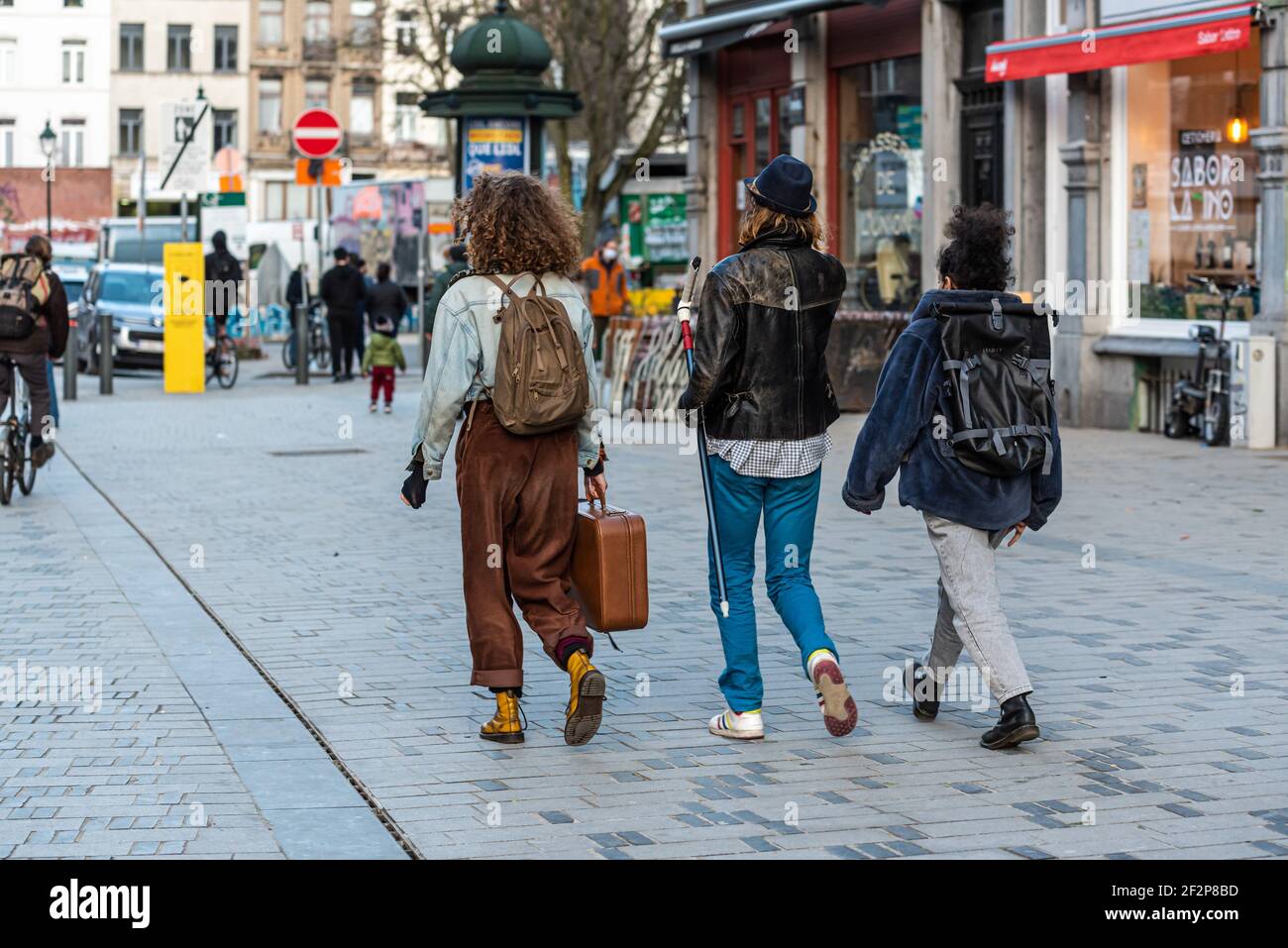 Saint- Gilles, Brussels Capital Region - Belgium: 02 26 2021: Fashionable girls going out at the Parvis market square Stock Photo