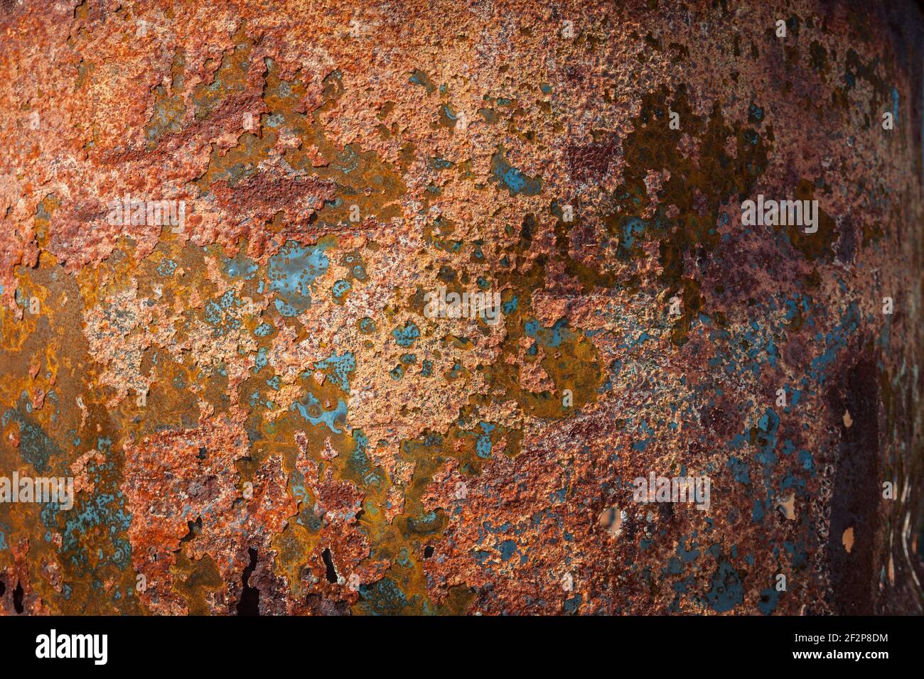Close up texture detail of orange and brown rusty metal corroded plate Stock Photo