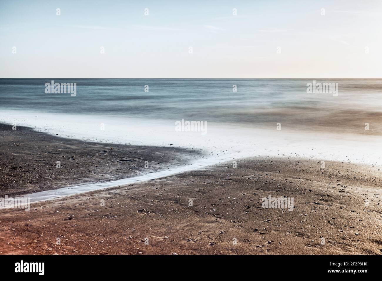 Long exposure of the surf at the ocean in Florida at sunset Stock Photo