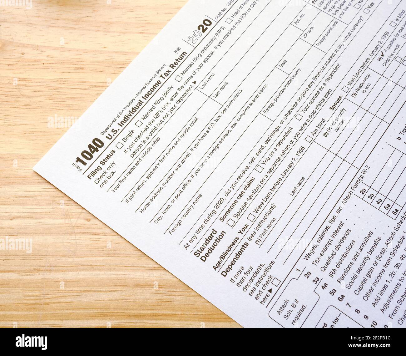 Blank 1040 Tax Form on Wood Table Stock Photo