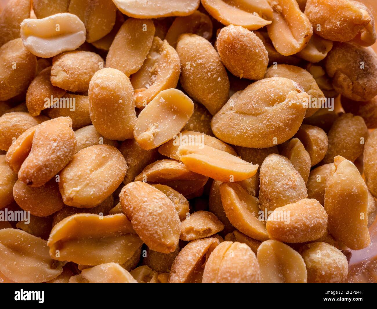 Lots of roasted and salted peanuts Stock Photo