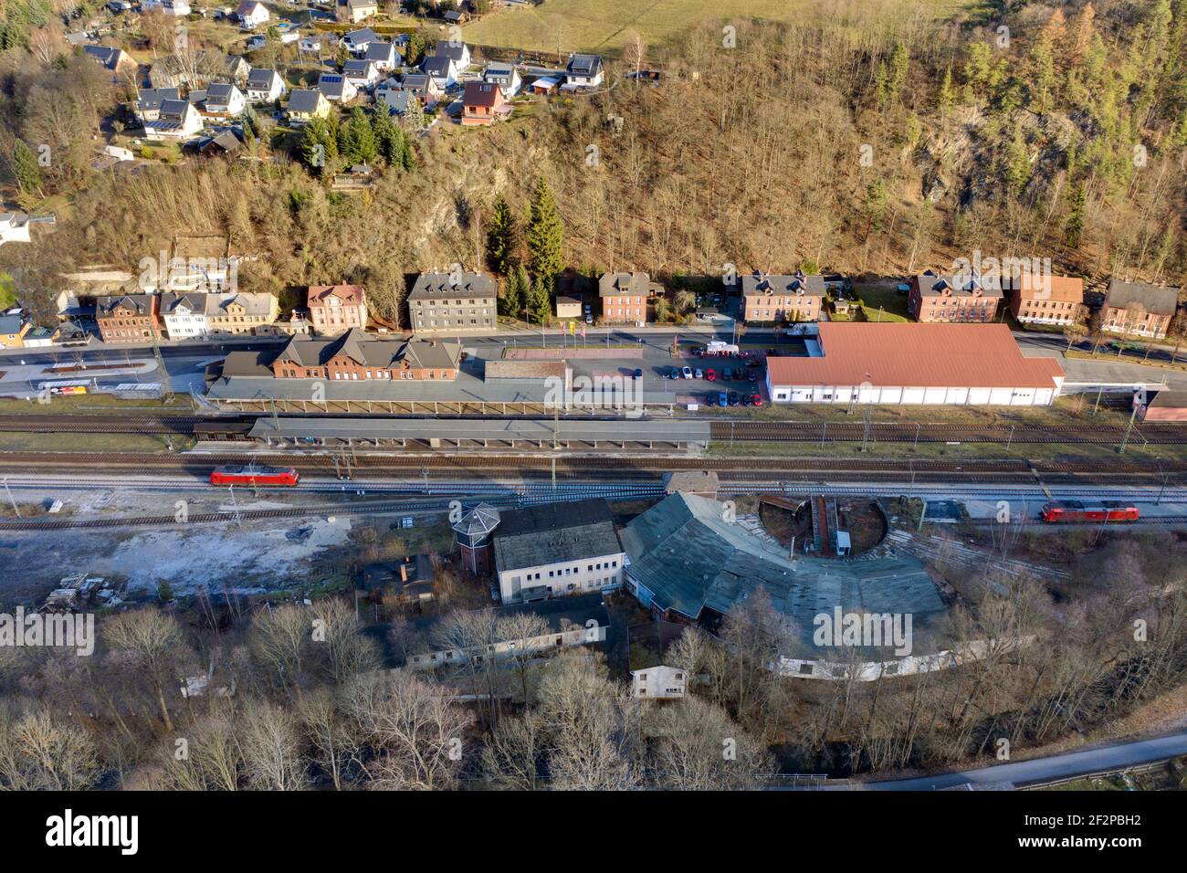 Germany, Thuringia, Probstzella, train station (former GDR border station), locomotive shed (closed), sliding locomotives waiting for operations, aerial view, oblique view Stock Photo