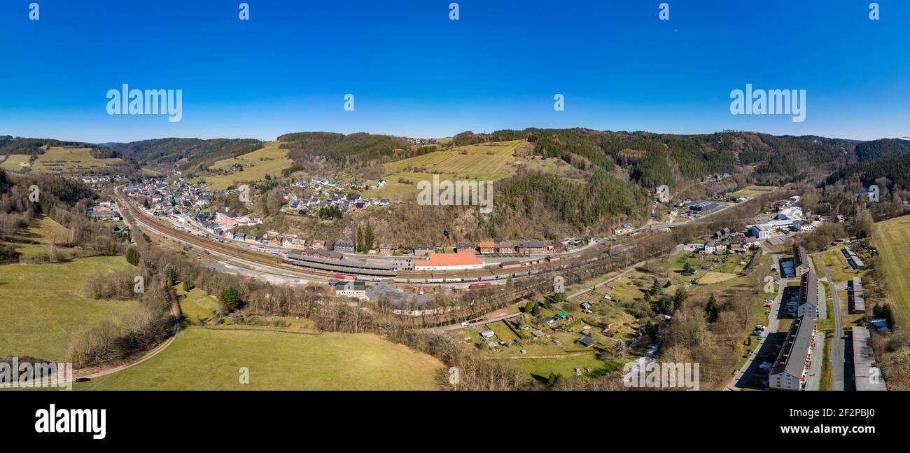 Railway station (former GDR border station), locomotive shed (closed), electric locomotives, freight train, aerial view, panorama picture Stock Photo