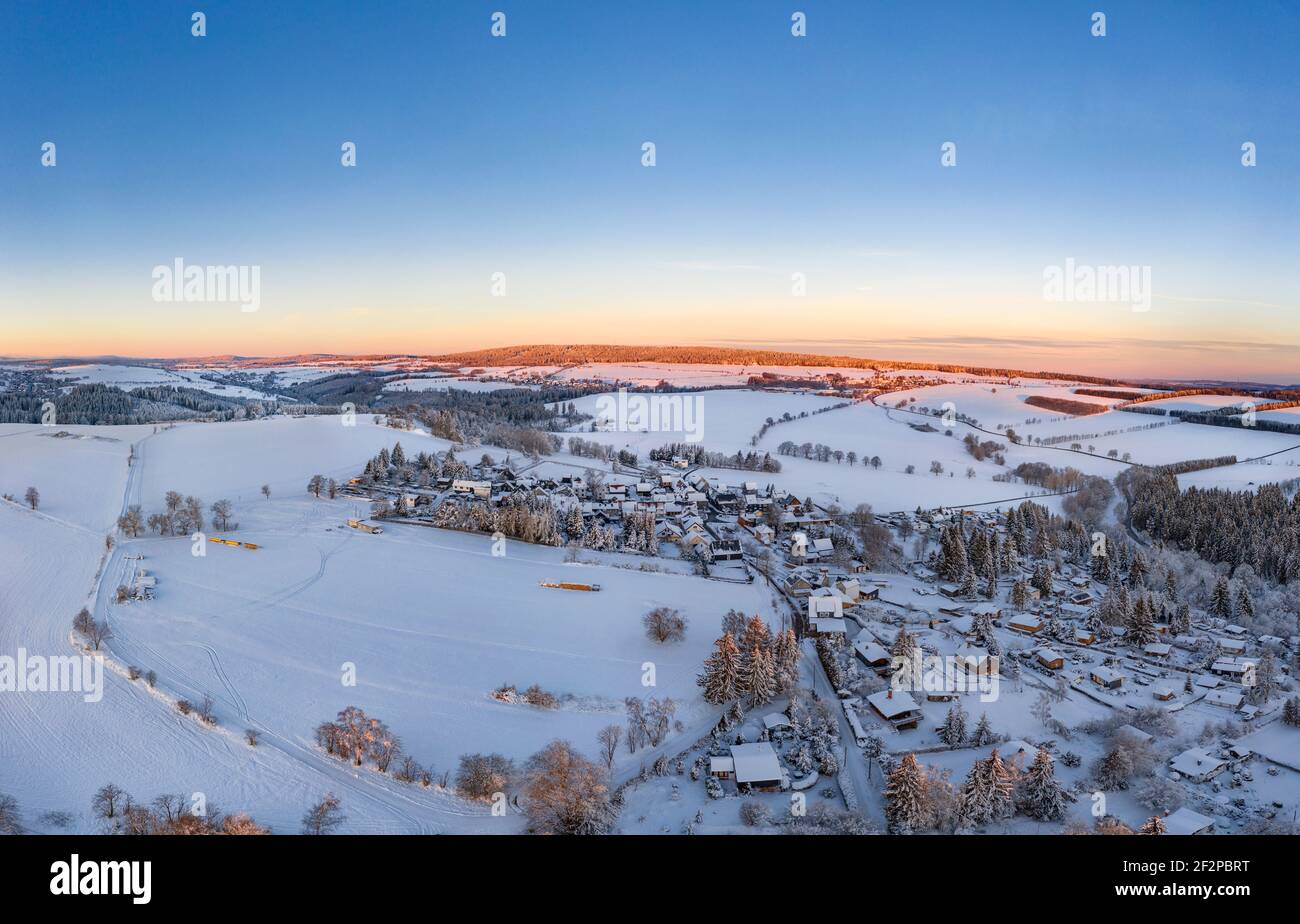 Germany, Thuringia, Grossbreitenbach, Allersdorf, village, snow, shortly before sunrise, aerial view Stock Photo