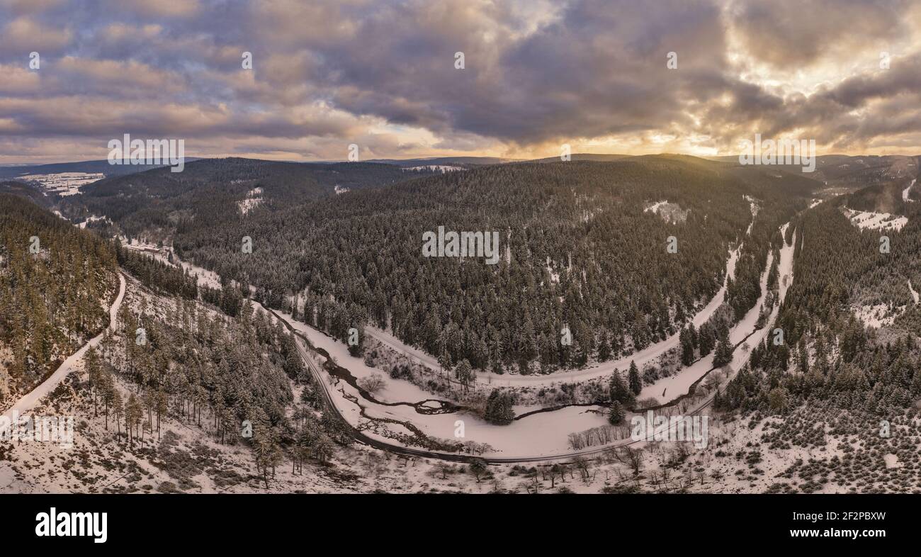 Germany, Thuringia, Gehren, forest, valley, brook, forest roads, snow, Rennsteig environment, back light, shortly before sunset, aerial view, panorama Stock Photo