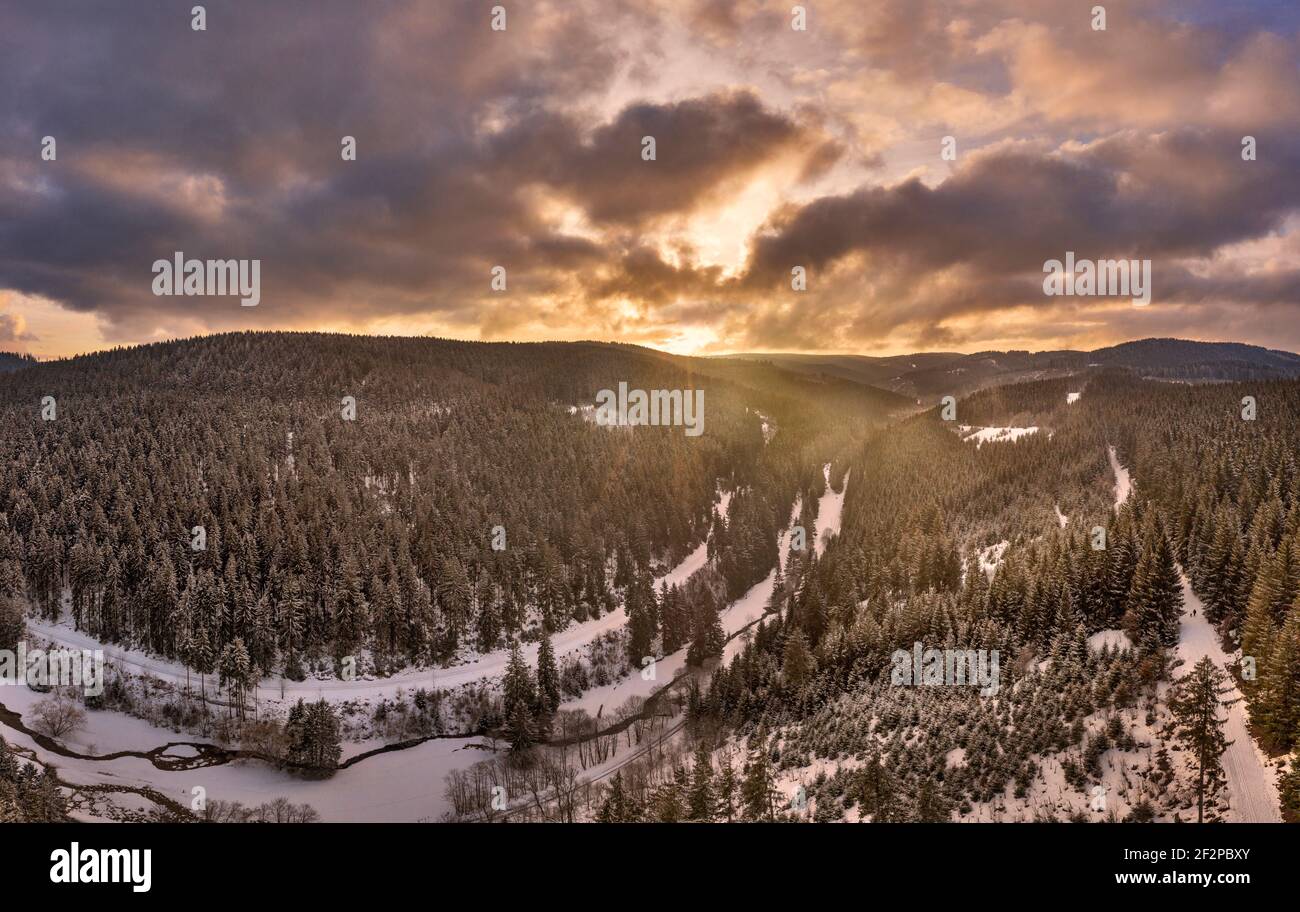 Germany, Thuringia, Gehren, forest, valley, brook, snow, Rennsteig environment, back light, aerial view, panorama Stock Photo
