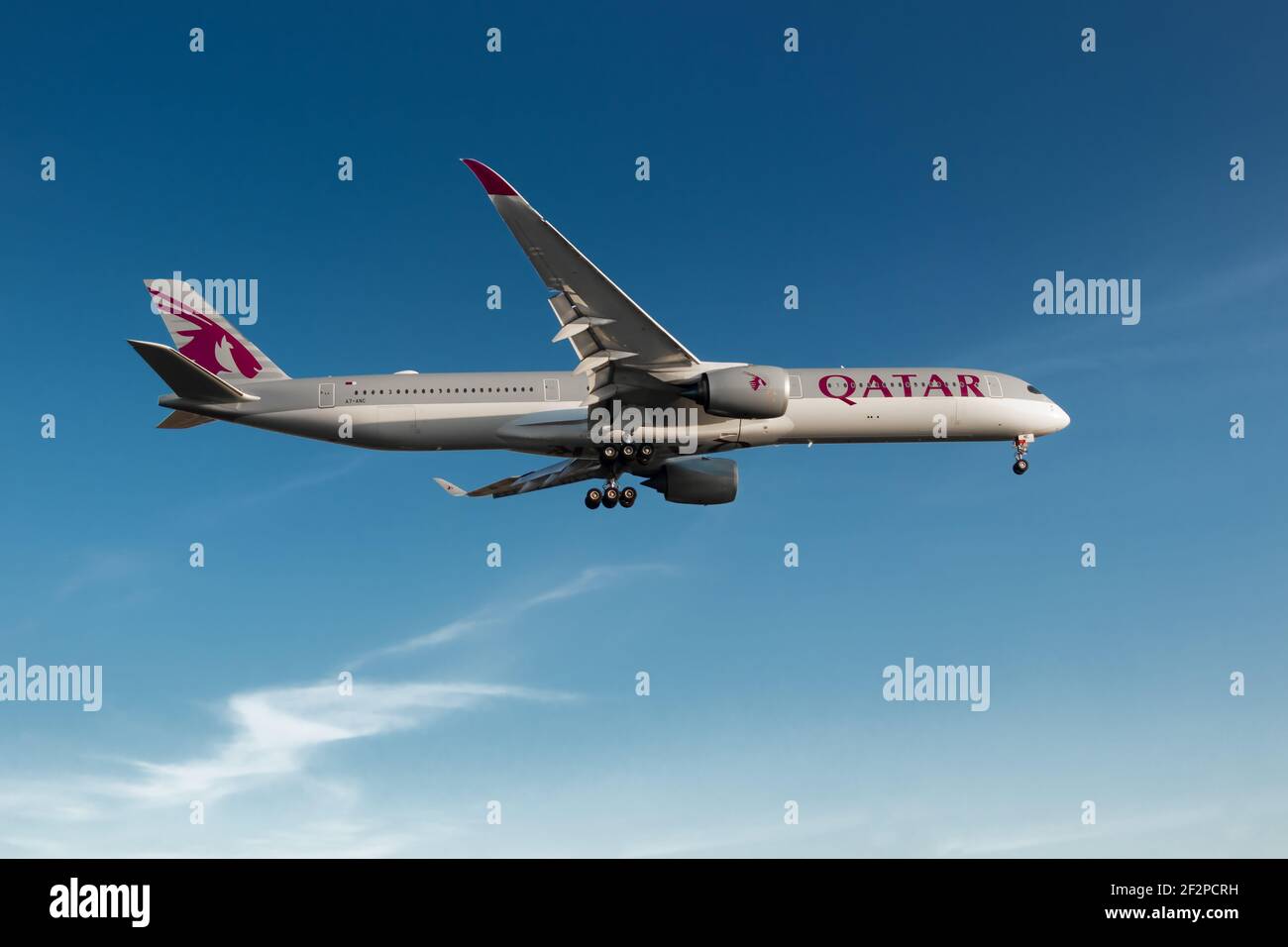 London, Heathrow Airport, UK, May 2020 - Qatar Airways, Airbus A350 on final approach during a warm and blue evening sky. Image Abdul Quraishi Stock Photo