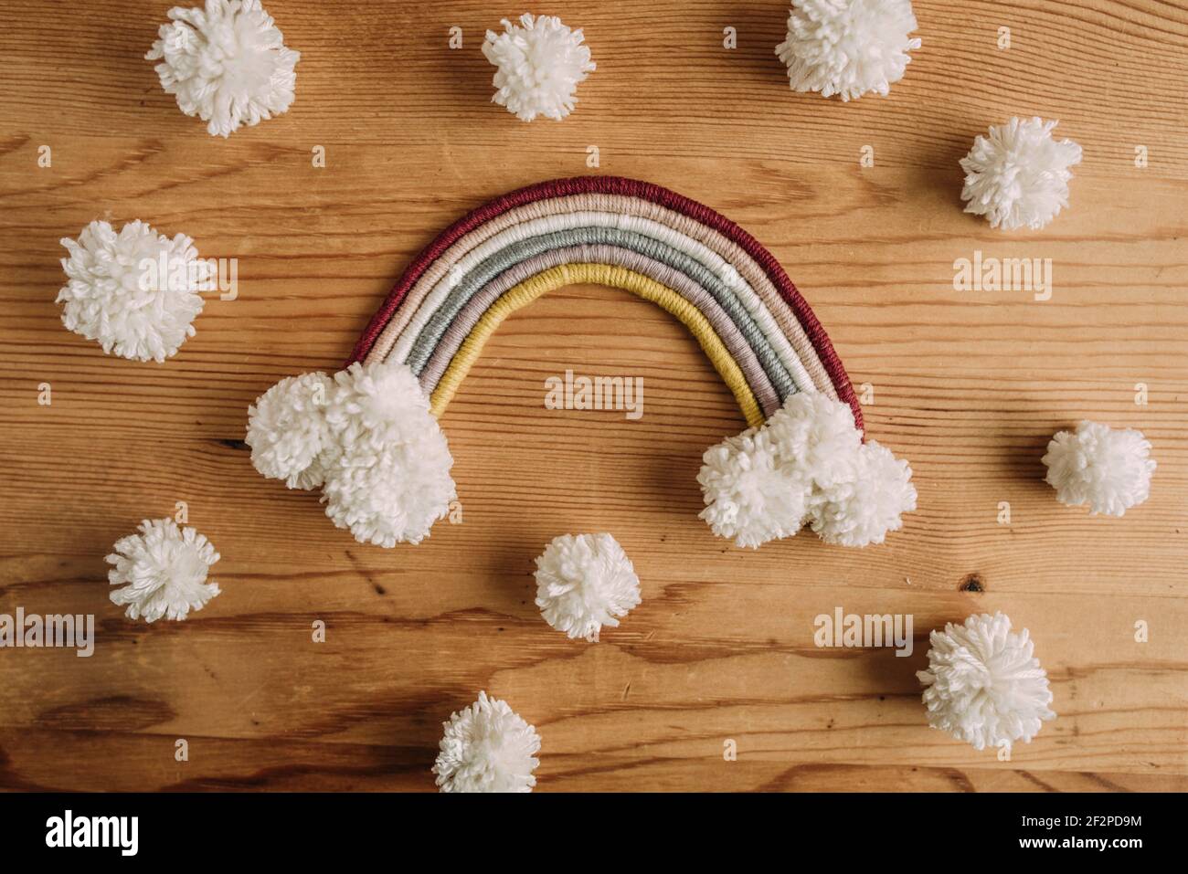 Macrame rainbow with white pompons Stock Photo