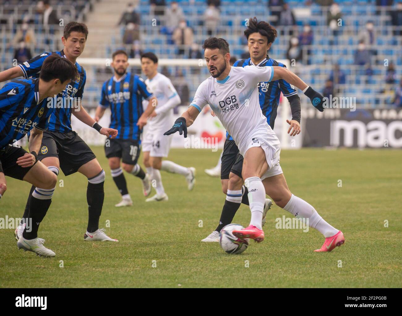 Incheon, South Korea. 06th Mar, 2021. Brazilian Cesar Fernando Silva Melo (front R) of Daegu FC, Song Si-Woo (R, 2nd row) and Mun Ji-Hwan (2nd L) of Incheon United FC in action during the 2nd round of the 2021 K League 1 soccer match between Incheon United FC and Daegu FC at the Incheon Football Stadium.(Final score; Incheon United FC 2:1 Daegu FC) (Photo by Jaewon Lee/SOPA Images/Sipa USA) Credit: Sipa USA/Alamy Live News Stock Photo